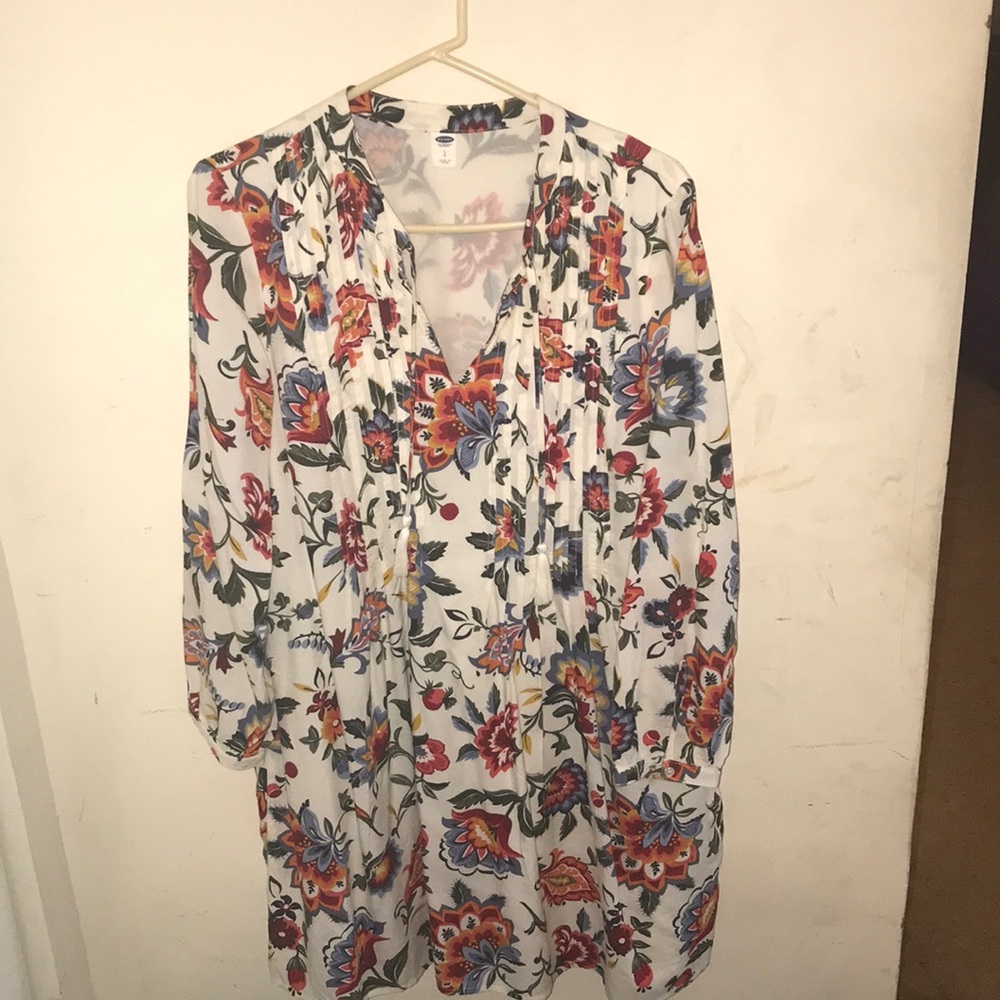 Off-white, knee-length dress.